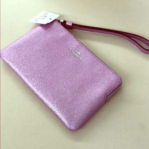 COACH Pink shimmery wristlet. Brand new with tags.